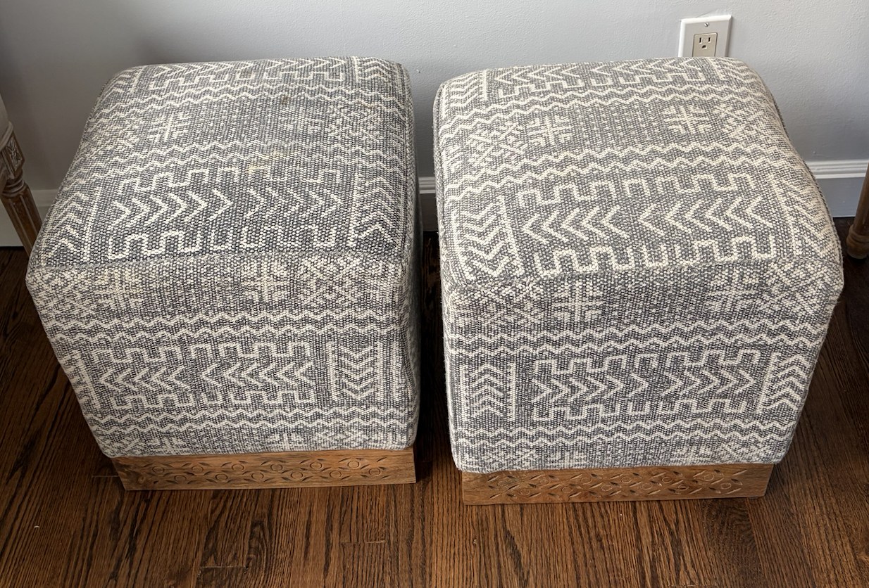 Pair of Upholstered Ottomans with Carved Wood Base